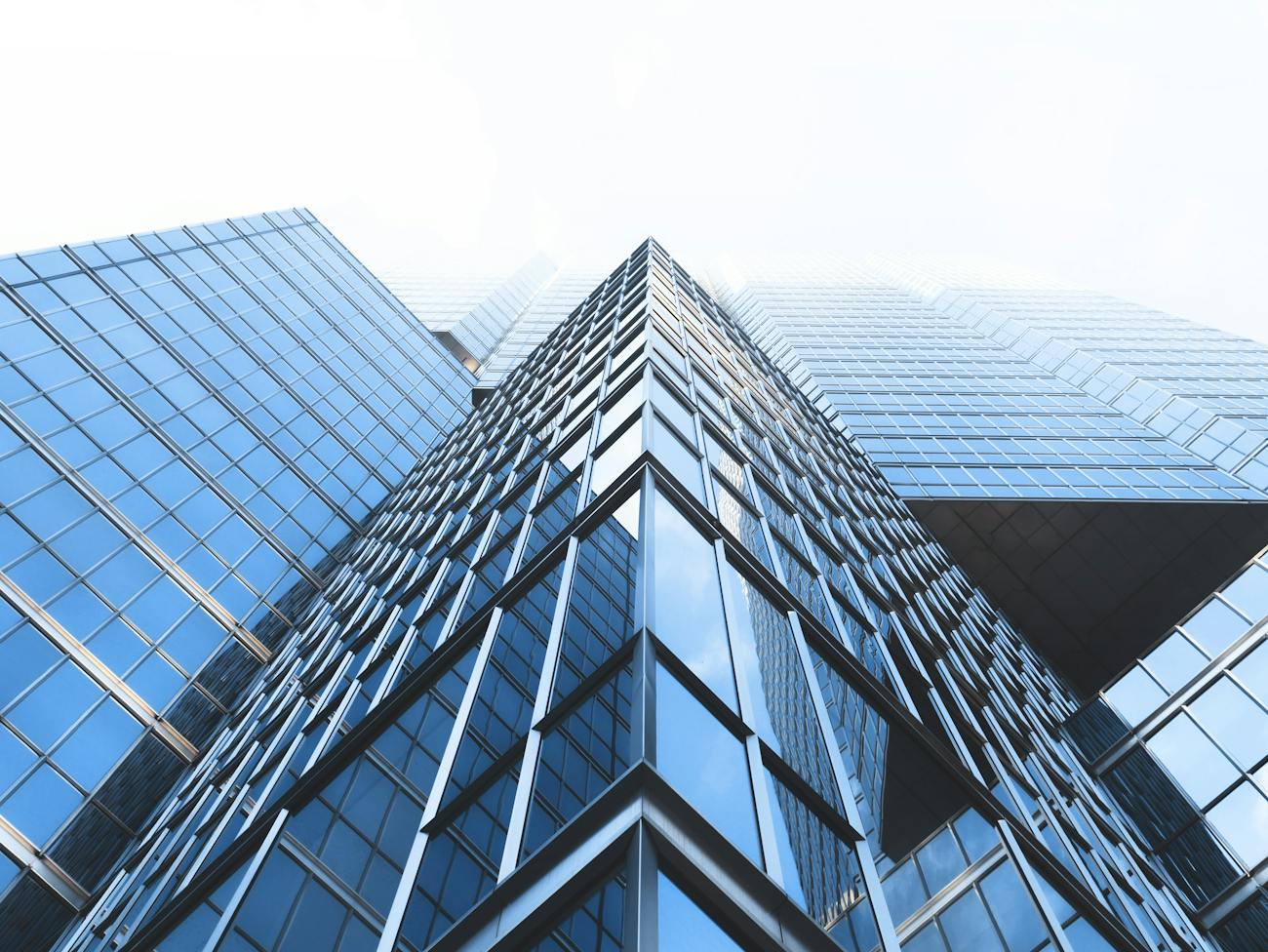 Glass office towers seen from street level